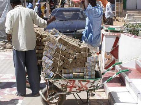 a wheelbarrow of cash by racy3000